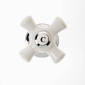 Cold faucet handle against white background