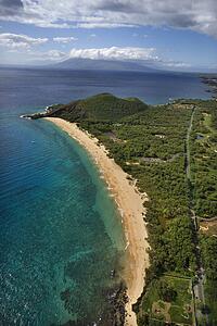 Aerial of coastline with sandy beach and Pacific ocean in Maui, Hawaii