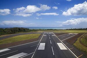 Aerial view of airport runway on coastline of Maui, Hawaii
