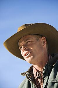 Male wearing a cowboy hat