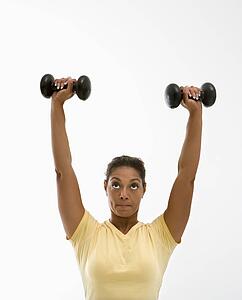 Woman holding dumbbells
