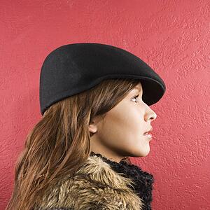 Woman wearing flat hat