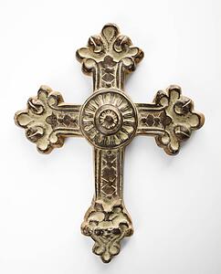 Ornamental religious cross against white background.