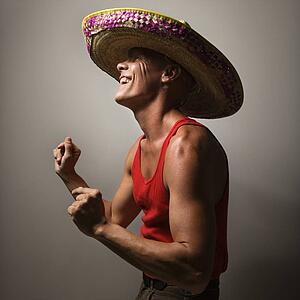 Male wearing sombrero snapping fingers