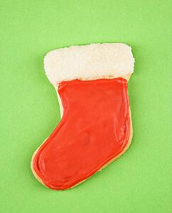 Christmas stocking sugar cookie with decorative icing.