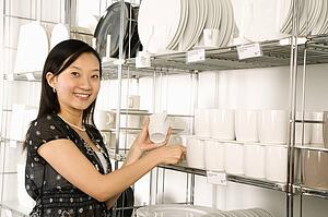 Woman shopping for dishes and glasses 