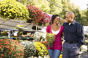 Happy couple picking out flowers
