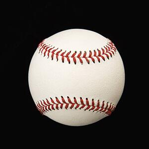Still life of baseball on black