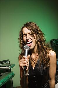 Female singing into microphone