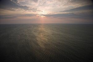 Scenic Bald Head Island North Carolina landscape of sunrise over ocean.