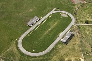 Aerial view of running track with bleachers.