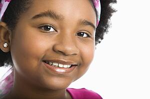 Girl wearing headband smiling