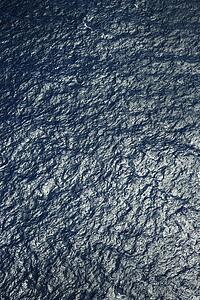 Aerial view of ocean water ripples.
