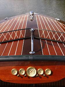 Detail of wooden boat dashboard and windshield. 