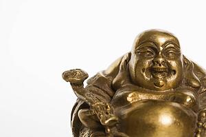 Happy laughing Buddha brass figurine on white background