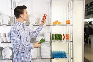 Man shopping for dishes and glasses 