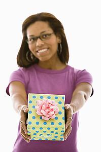 Woman holding wrapped package