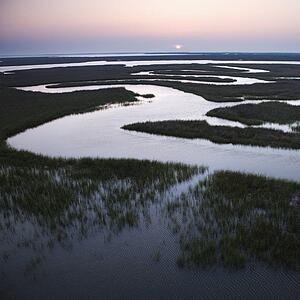 Aerial scenic view of winding waterway in marshland at Baldhead Island, North Carolina.
