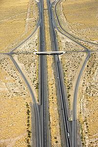 Aerial view of desert highway with overpass