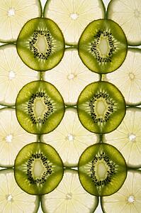 Lime and kiwi fruit slices arranged on white background.