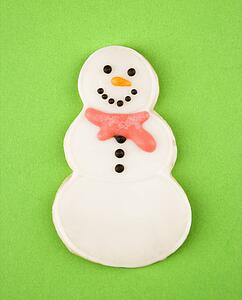 Snowman sugar cookie with decorative icing.