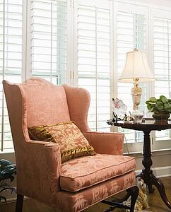Chair in living room with windows 