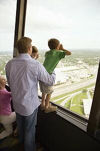 Family looking out observation deck 