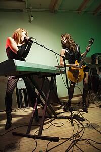 Girls singing playing in a band