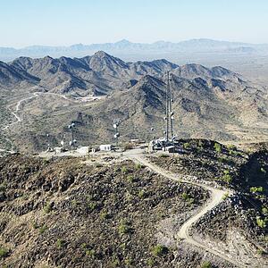 Aerial view of satellite communications towers in southwest rural landscape of Arizona