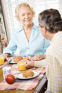 Mature Caucasian couple having breakfast together.