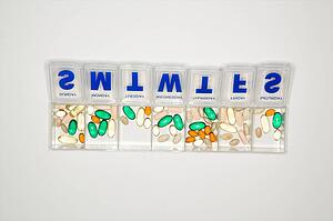 Weekly container with pills and vitamins.