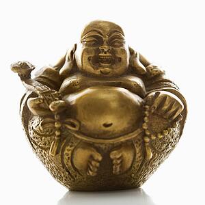 Happy laughing Buddha brass figurine on white background.