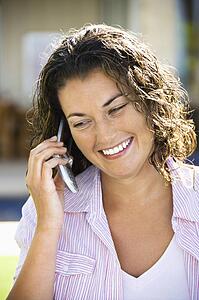 Smiling woman on a cell phone