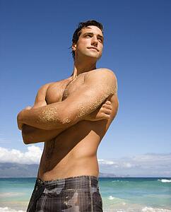 Handsome man standing on Maui, Hawaii beach