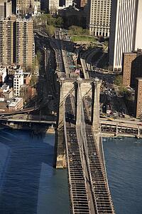 Aerial view of Brooklyn Bridge with New York City buildings.