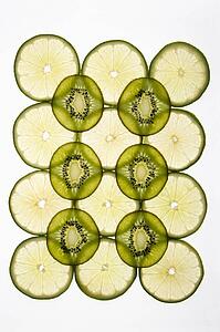 Lime and kiwi fruit slices arranged on white background.