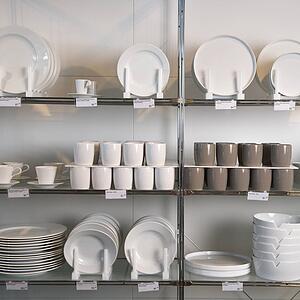 Retail display of porcelain dishes and mugs