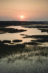Aerial view of pier in coastal wetland on Bald Head Island, North Carolina