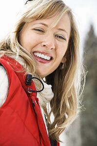 Woman wearing red ski vest