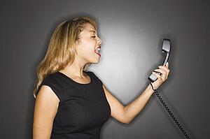 Woman yelling into phone 