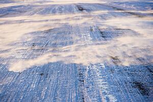 Ice covered road with tire marks