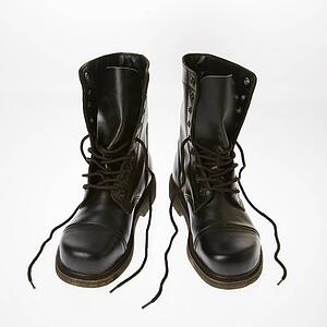 Black leather boots with laces untied