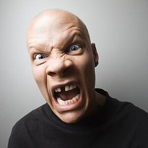 Portrait of mid-adult Caucasian male with angry expression.