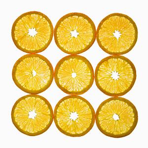 Orange slices arranged in square design on white background.