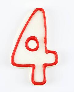 Sugar cookie in the shape of a number four outlined in red icing.
