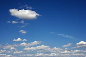 Peaceful clouds in blue sky.