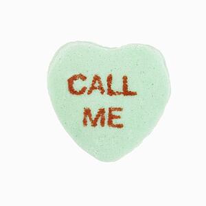 Green candy heart that reads call me against white background.