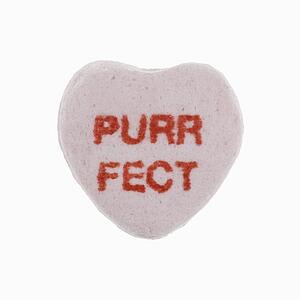 Purple candy heart that reads purrfect against white background.