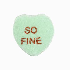 Green candy heart that reads so fine against white background.