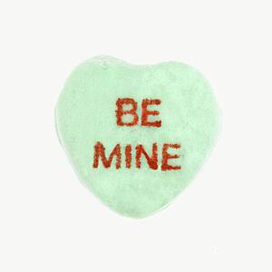 Green candy heart that reads be mine against white background.